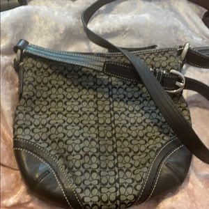 Black cross body Coach purse.